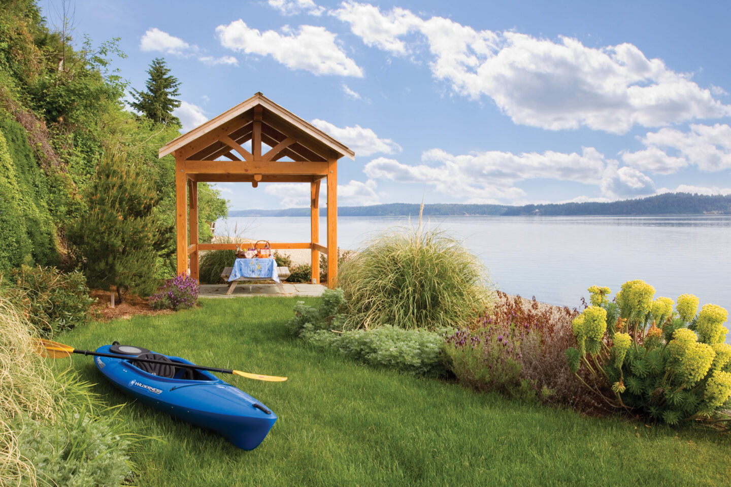 beach shelter with kayak and picnic setting on Puget Sound