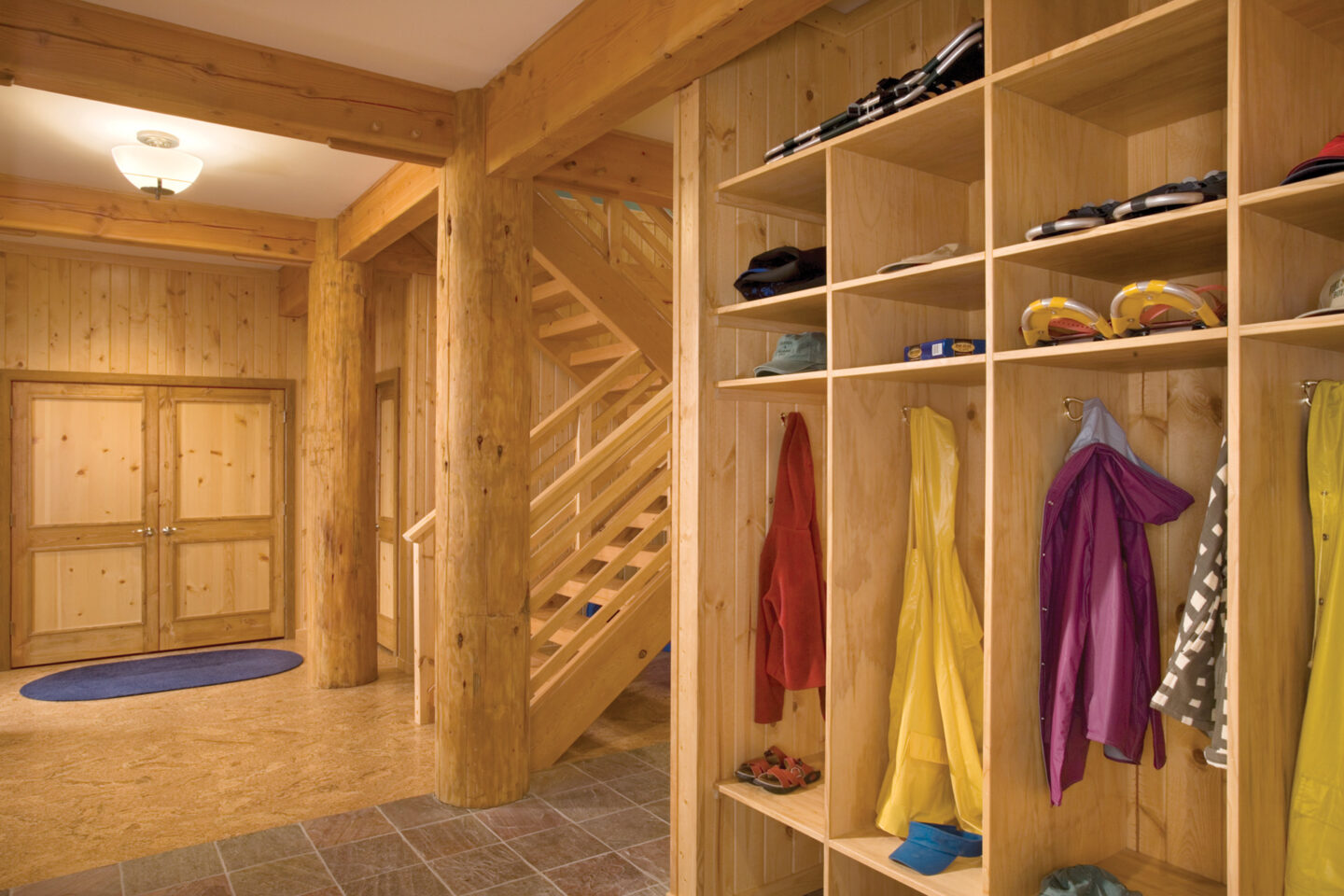 A secondary entry and a mudroom that provides storage for coats, shoes, and sports gear help keep the main areas of a home clean.