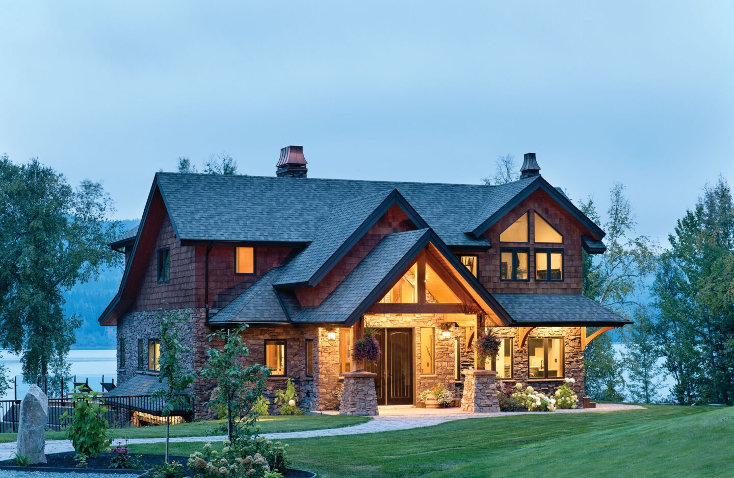 WilC-08 The meandering walkway leading to the spacious front porch welcomes you into this stunning modern timber frame home